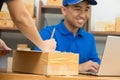 Employees receive parcels from customers and writing addresses for shipping products, Royalty Free Stock Photo