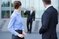 Employees talking in front of business centre Royalty Free Stock Photo