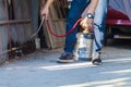 Employees at a termite control company are using a chemical sprayer to get rid of termites at customers` homes and search for