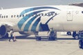 Employees unloading luggage at airport 2 Royalty Free Stock Photo