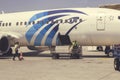 Employees unloading luggage at airport Royalty Free Stock Photo