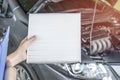 Employees women of the car service center checking filter cooling system and check list for maintenance concept of service car Royalty Free Stock Photo