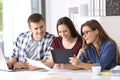 Employees working on line with tablet at office