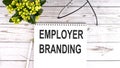 Employer Branding text concept write on notebook on wooden background Royalty Free Stock Photo