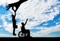 Employer hand chooses a healthy employee, not a disabled person in a wheelchair