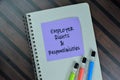 Employer Rights & Responsibilites write on sticky notes isolated on Wooden Table Royalty Free Stock Photo