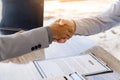 An employer shakes hands of a male job applicant congratulating the position. The HR manager is happy to hire job applicants to sh Royalty Free Stock Photo