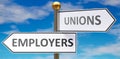 Employers and unions as different choices in life - pictured as words Employers, unions on road signs pointing at opposite ways to