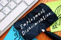 Employment Discrimination inscription on the piece of paper