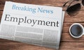 Employment headlined newspaper on the table, News Paper's Name is Braking News Royalty Free Stock Photo