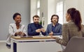 Friendly human resources commission interviewing woman during meeting in office. Royalty Free Stock Photo