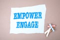 EMPOWER ENGAGE concept. Text on note sheet