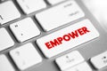 Empower - to give power or authority to, authorize, especially by legal or official means, text concept button on keyboard Royalty Free Stock Photo