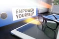 EMPOWER YOURSELF Businessman working at office desk and using a Royalty Free Stock Photo