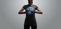 Empowered fit woman holding world in her hands Royalty Free Stock Photo