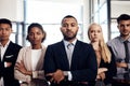 An empowered team is a winning team. a group of confident and diverse young businesspeople working together in a modern Royalty Free Stock Photo