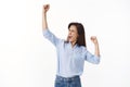 Empowered triumphing joyful middle-aged woman celebrating success, fist pump victory gesture, close eyes yelling oh yeah Royalty Free Stock Photo