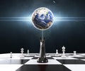 Empowering of the Earth with Chess on the chessboard. Chess business concept, leader & success.