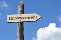 Empowerment - wooden signpost with one arrow