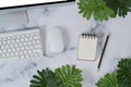 Notebook and computer on marble background.