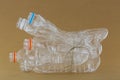 Emptied recyclable clear plastic mineral soda water bottles tied