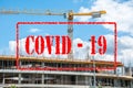 Empty and abandoned building construction site with scaffolds and construction crane closed for coronavirus or covid 19 virus pand Royalty Free Stock Photo