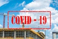 Empty and abandoned building construction site with scaffolds and construction crane closed for coronavirus or covid 19 virus pand