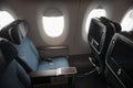 Empty aircraft premium economy class seats and windows