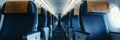 Empty Airplane Cabin Interior With a View Down The Aisle, Symmetrical Rows of Blue Passenger Seats Royalty Free Stock Photo