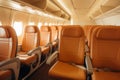 Empty airplane cabin with orange seats