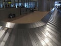 Empty airport luggage belt in motion