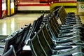 Empty airport seating - typical black chairs in boarding waiting Royalty Free Stock Photo