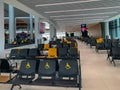 Empty airport seats and halls no people during covid-19 corona virus pandemic epidemy in the world quarantine. Horizontal image