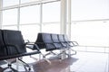Empty Airport Terminal Chairs. French Windows Royalty Free Stock Photo