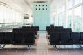 Empty Airport Terminal Chairs. French Windows Royalty Free Stock Photo