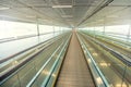 Empty airport terminal due to coronavirus pandemic and suspended airline flights. Empty airport terminal. Mechanical corridor with