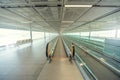 Empty airport terminal due to coronavirus pandemic and suspended airline flights. Empty airport terminal. Mechanical corridor with