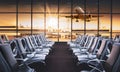 Empty airport terminal lounge with airplane on background. Modern airport waiting area with flyinf airplane and seats. Lounge and Royalty Free Stock Photo