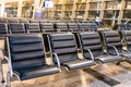 Empty airport terminal waiting area with chairs at night Royalty Free Stock Photo