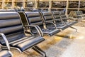 Empty airport terminal waiting area with chairs at night, travel concept Royalty Free Stock Photo