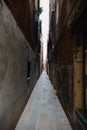 An empty alley with brown brick walls in daylight Venice, Italy Royalty Free Stock Photo