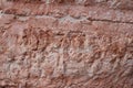 Empty ancient raw rough nature pink red stone concrete texture wall for retro restaurant, website Royalty Free Stock Photo