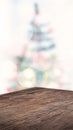 Empty angle brown wood table with abstract Christmas tree decor string light blur background,Holiday backdrop,Mockup vertical Royalty Free Stock Photo