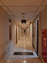 empty apartment hallway with exit sign