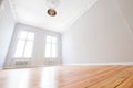 Empty apartment room with wooden floor after renovation in beautiful old building Royalty Free Stock Photo