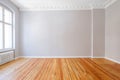 Empty apartment room with wooden floor and stucco ceiling Royalty Free Stock Photo