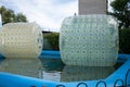 An empty aqua zorbing attraction in an amusement park