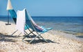 Empty armchair on the sea beach.