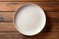 empty artistic ceramic Glazed earthenware white fancy shape plate, golden cutlery on side.