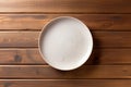 empty artistic ceramic Glazed earthenware white fancy shape plate, golden cutlery on side.